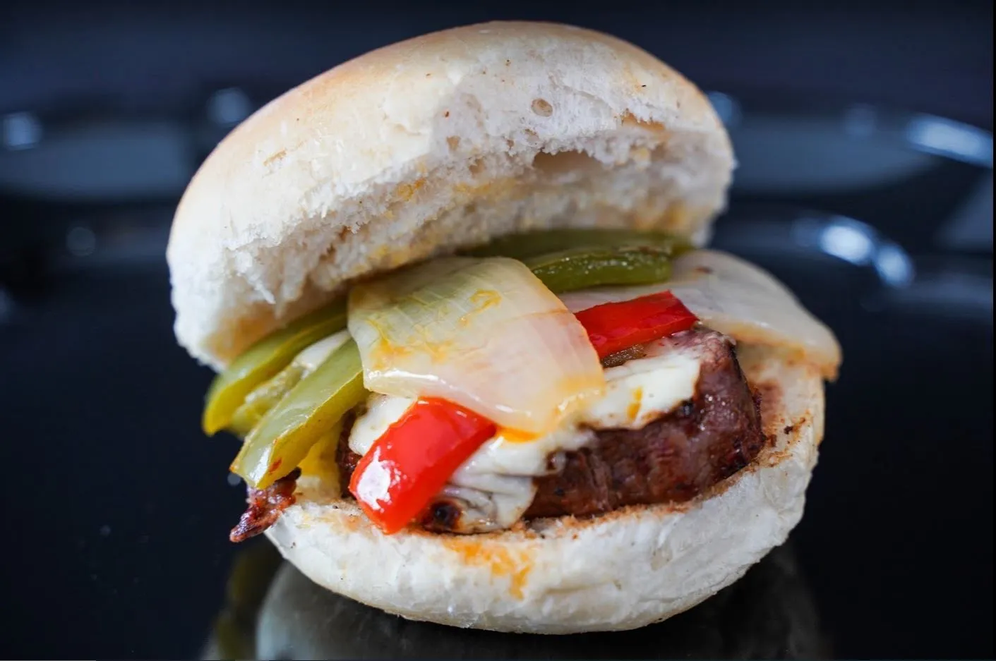 Filet sandwich with cheese, peppers, and pickles