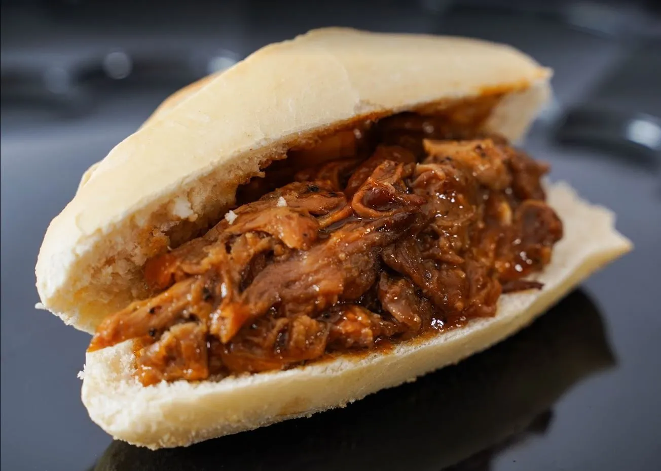 Pulled pork sandwich with barbecue toppings